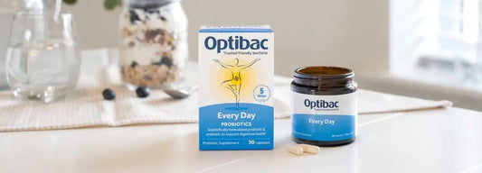 A container of probiotics displaying the health benefits of probiotics